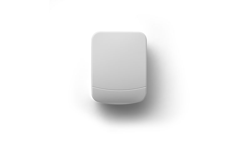 Garage door sensor on white wall.