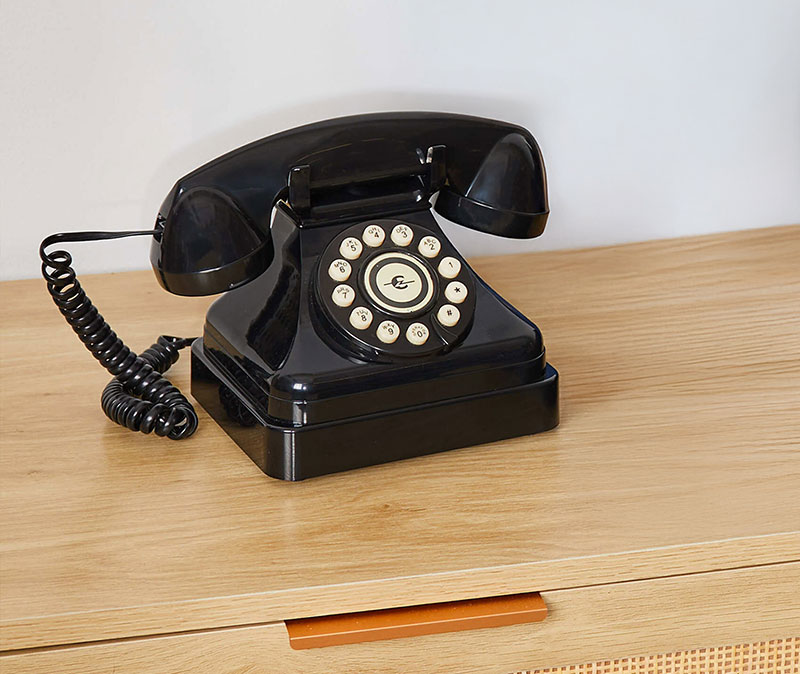 An image of Ooma Telo with Black Kettle Phone next to it.