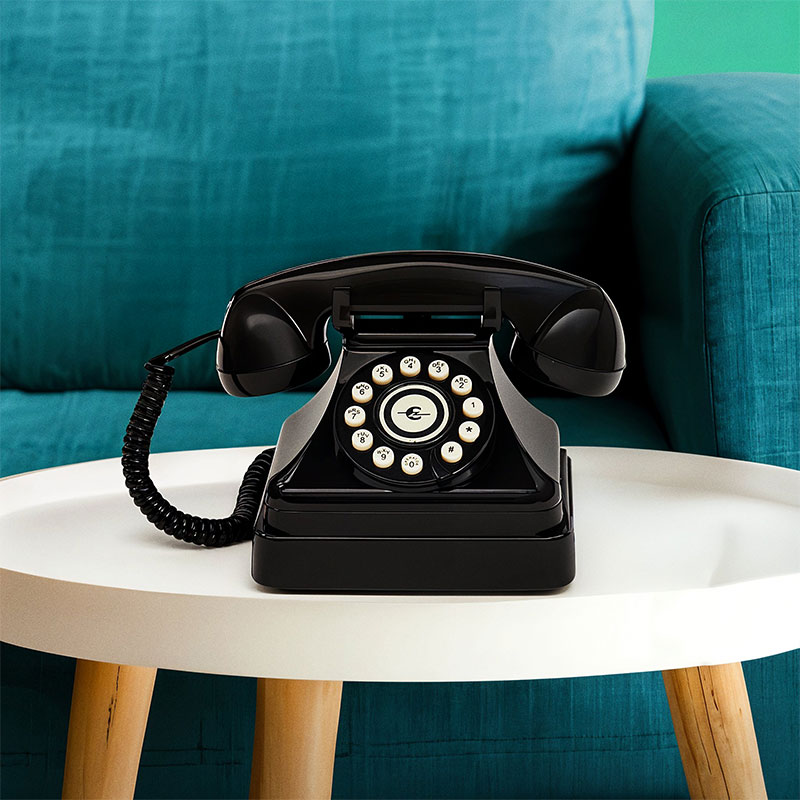 An image of Ooma Telo with Black Kettle Phone next to it.