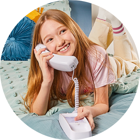 Child smiling and saying hello