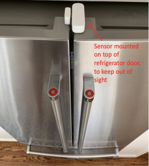 Sensor mounted on top of refrigerator door to keep it out of sight
