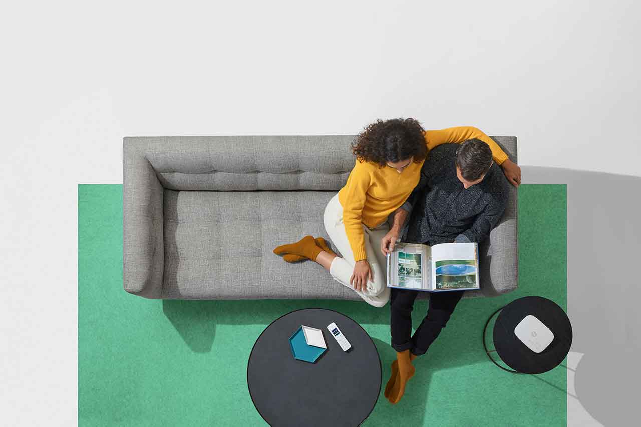 Couple sitting on sofa at home