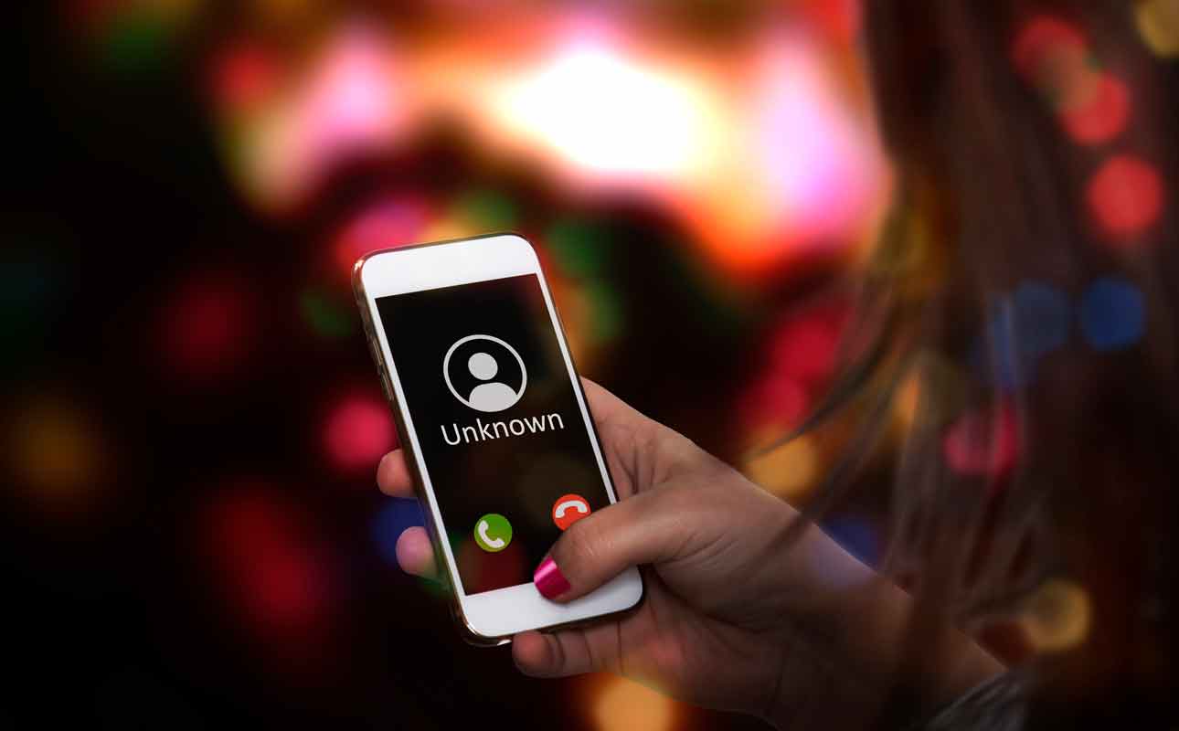 mobile phone displaying that a call is coming from an unknown number